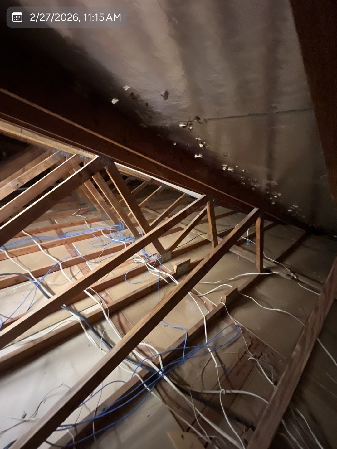 Attic space before new insulation was installed by MVP