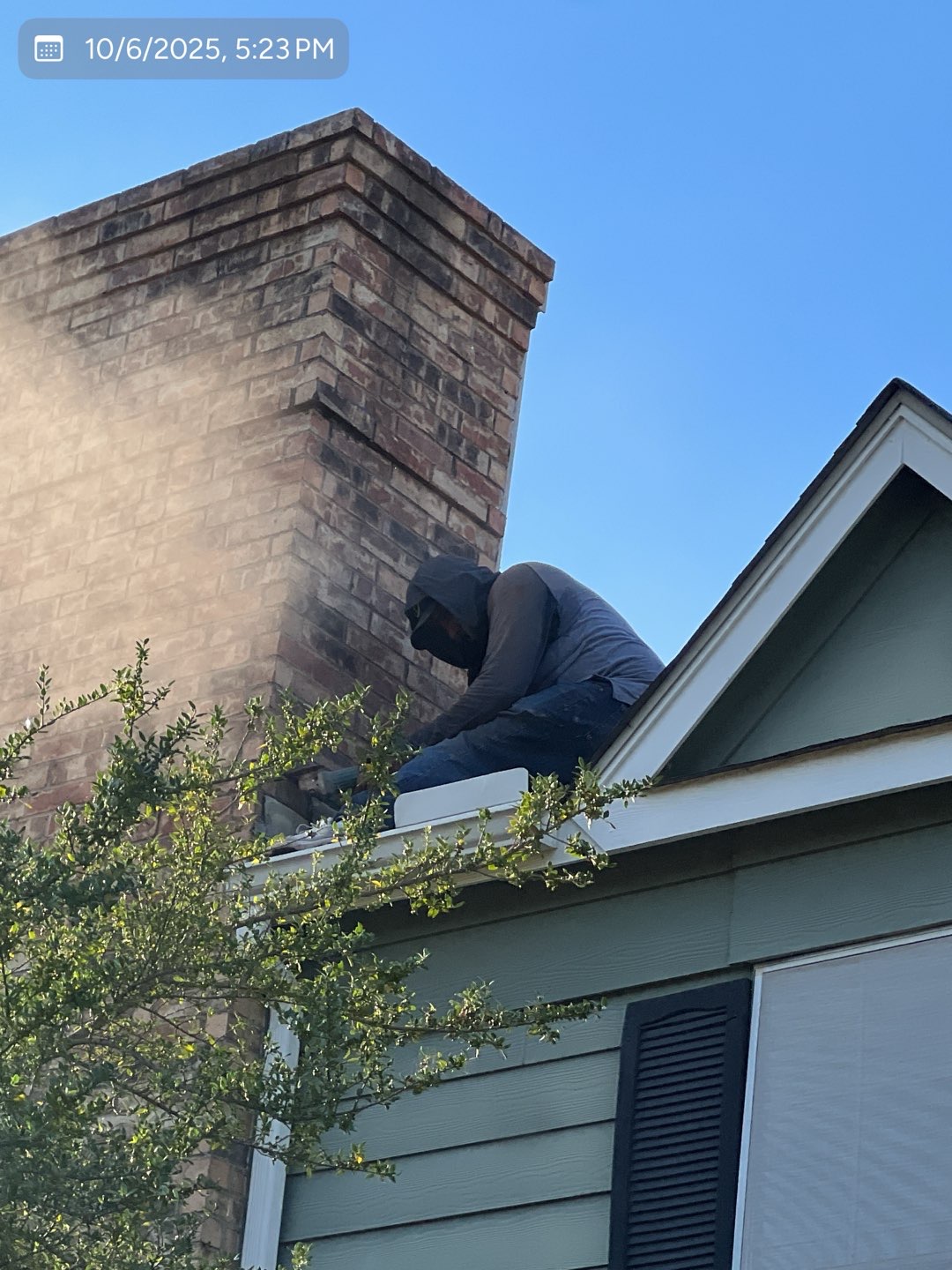 Roof-level view of chimney repair project