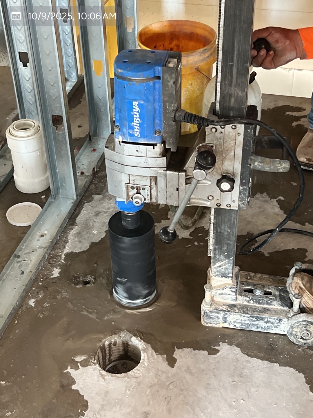 Core-drilling equipment positioned over a commercial concrete floor opening