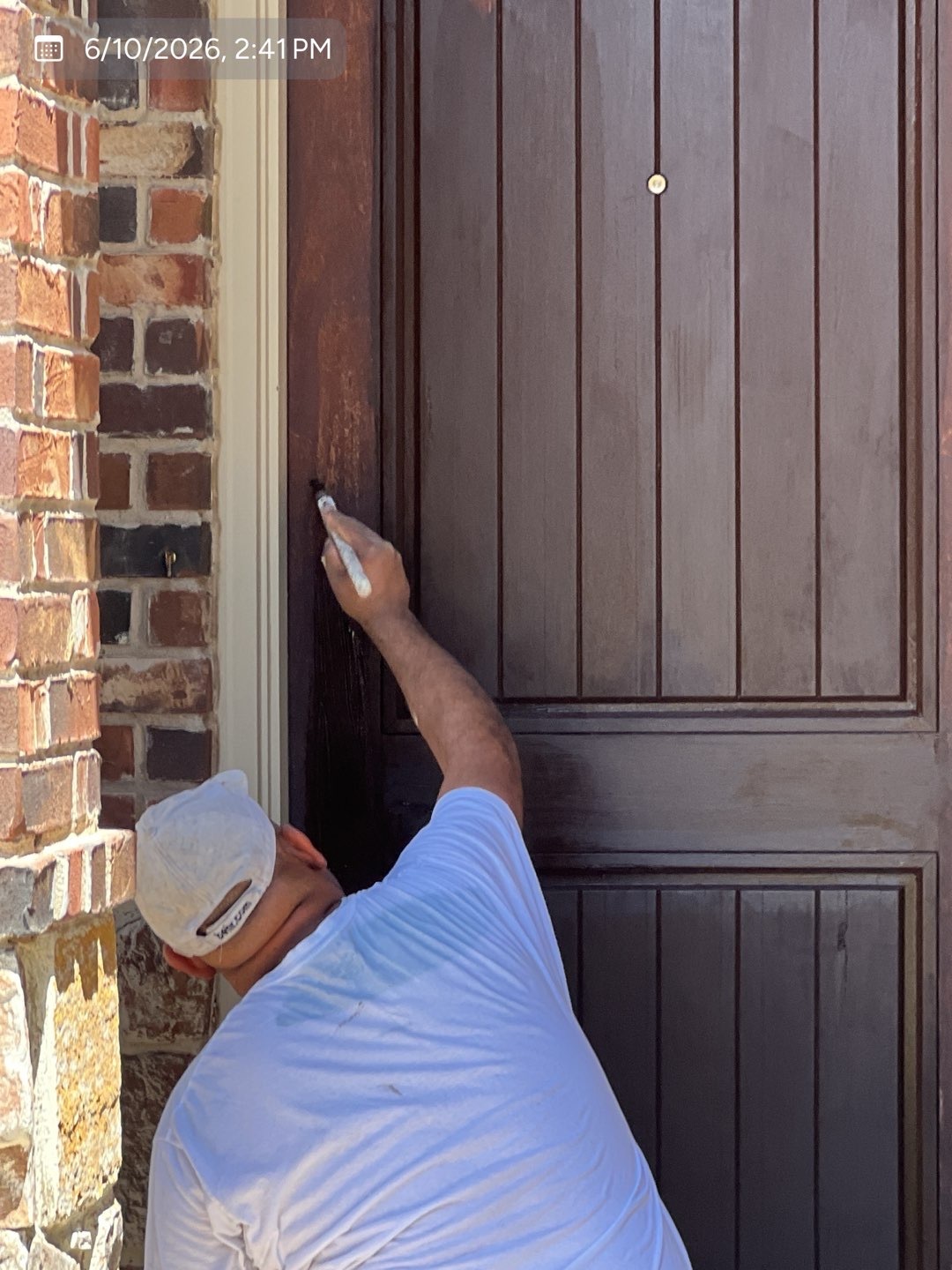 Detailed brush application around a residential front door by MVP