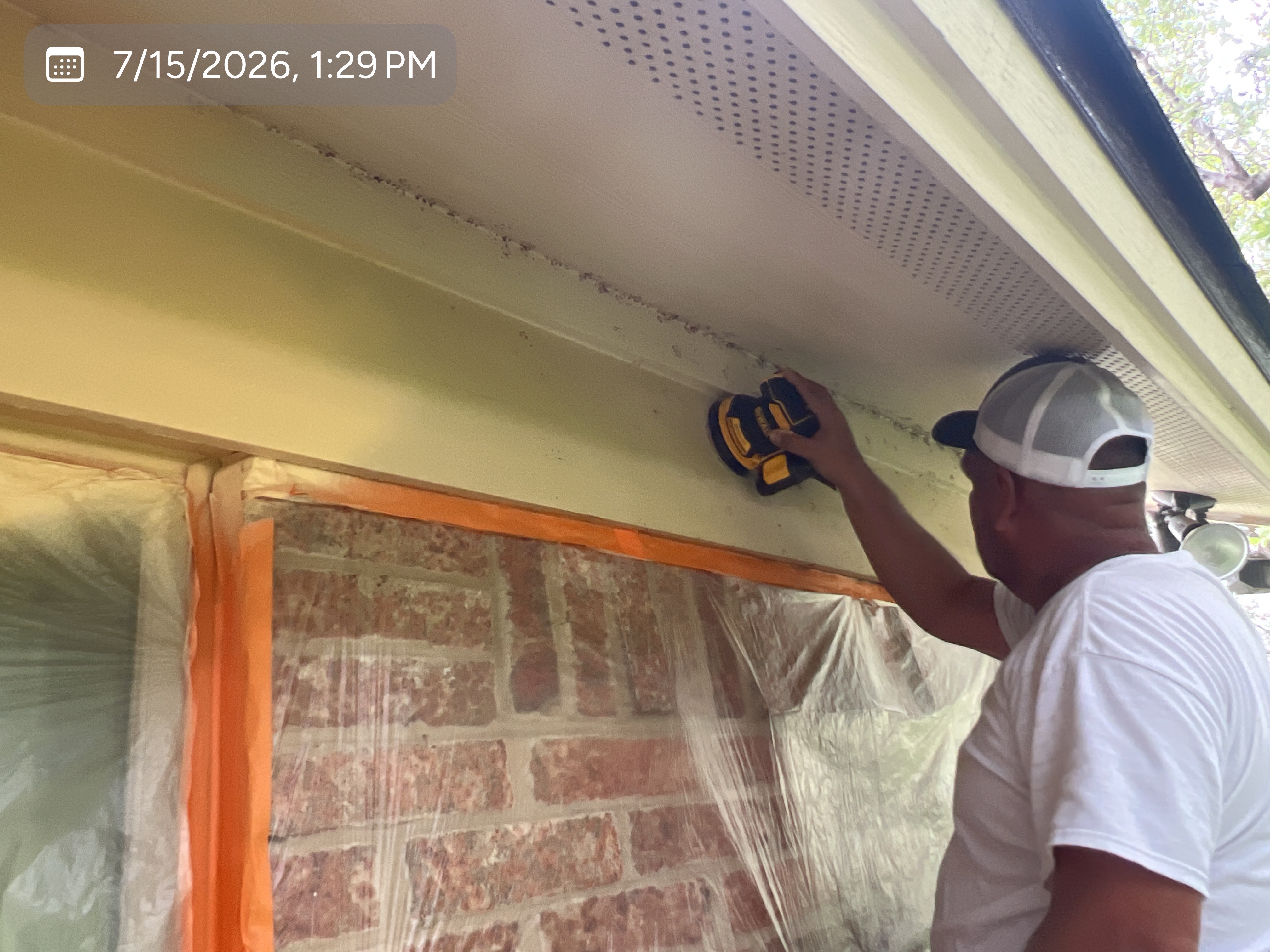 MVP crew member preparing an exterior surface for finishing