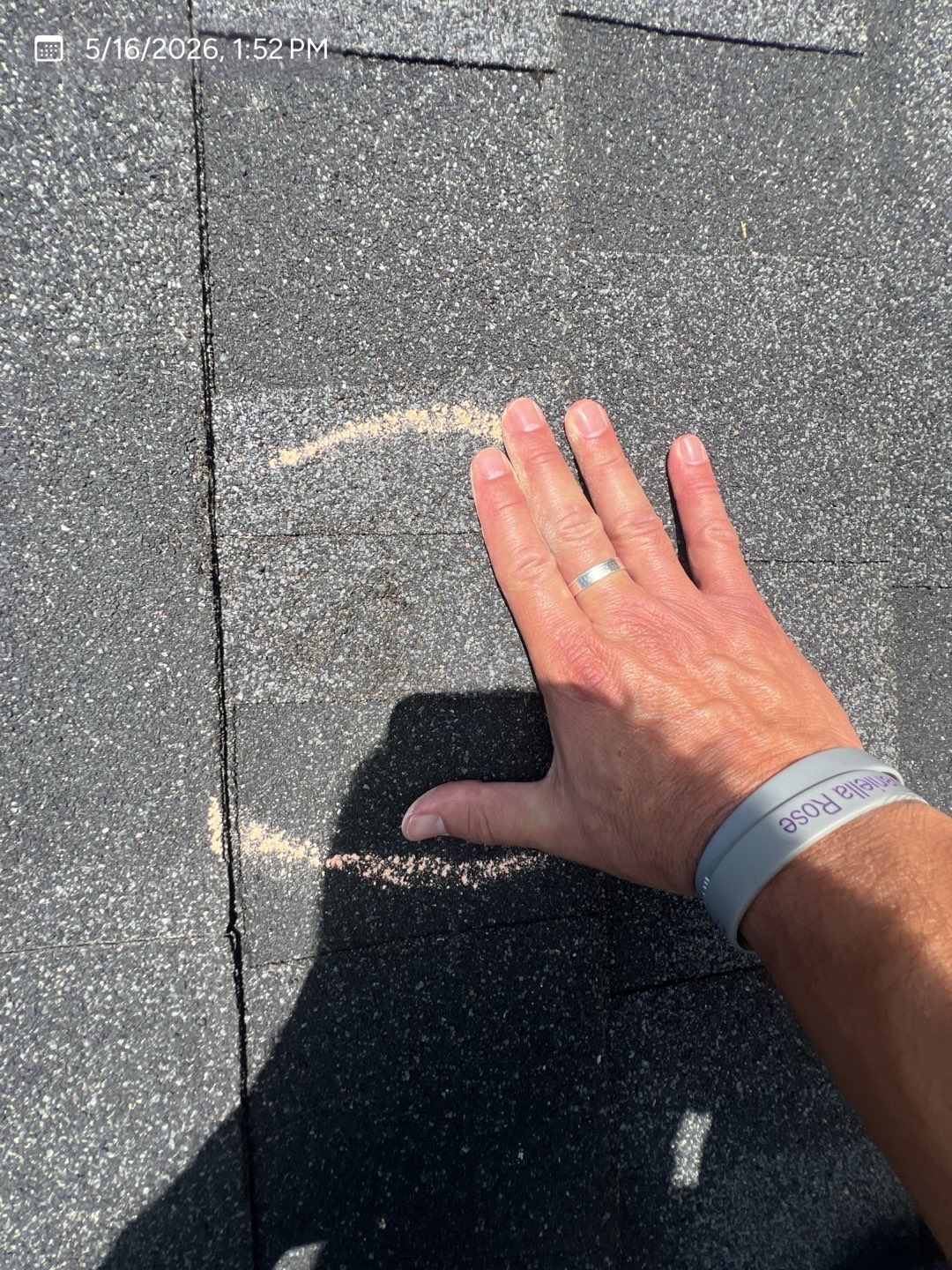 Marked shingle surface examined by hand during an MVP hail inspection