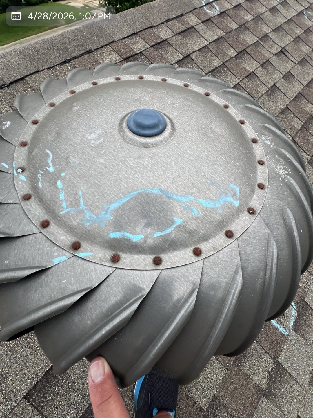 Hail impact marks documented on a roof turbine vent