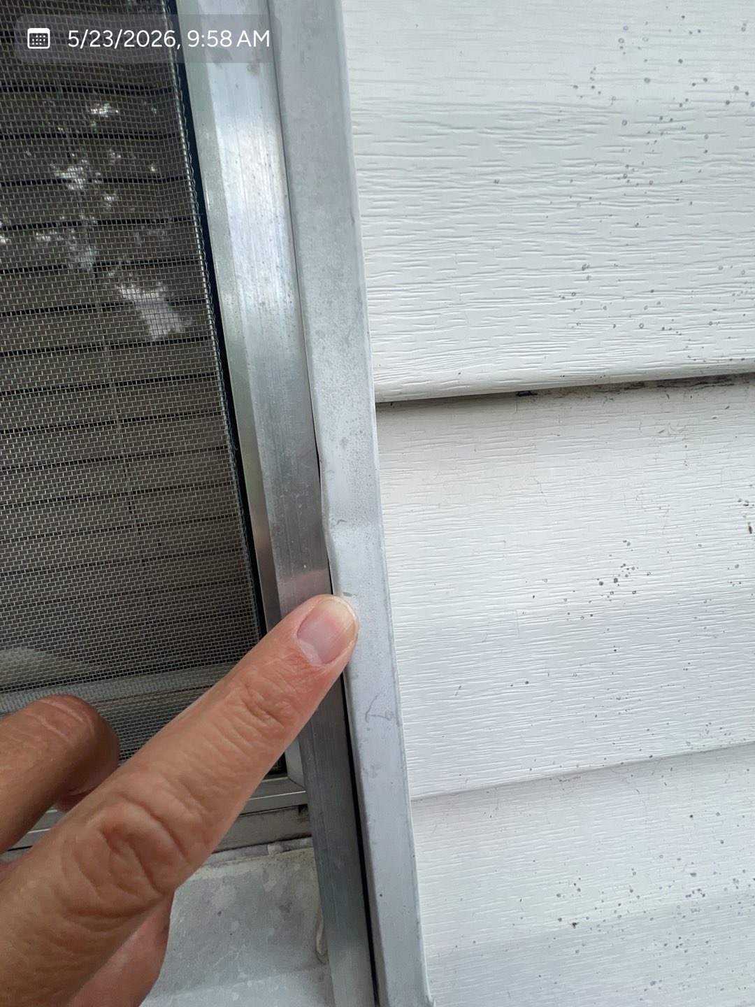 Hail impact documented on a window frame