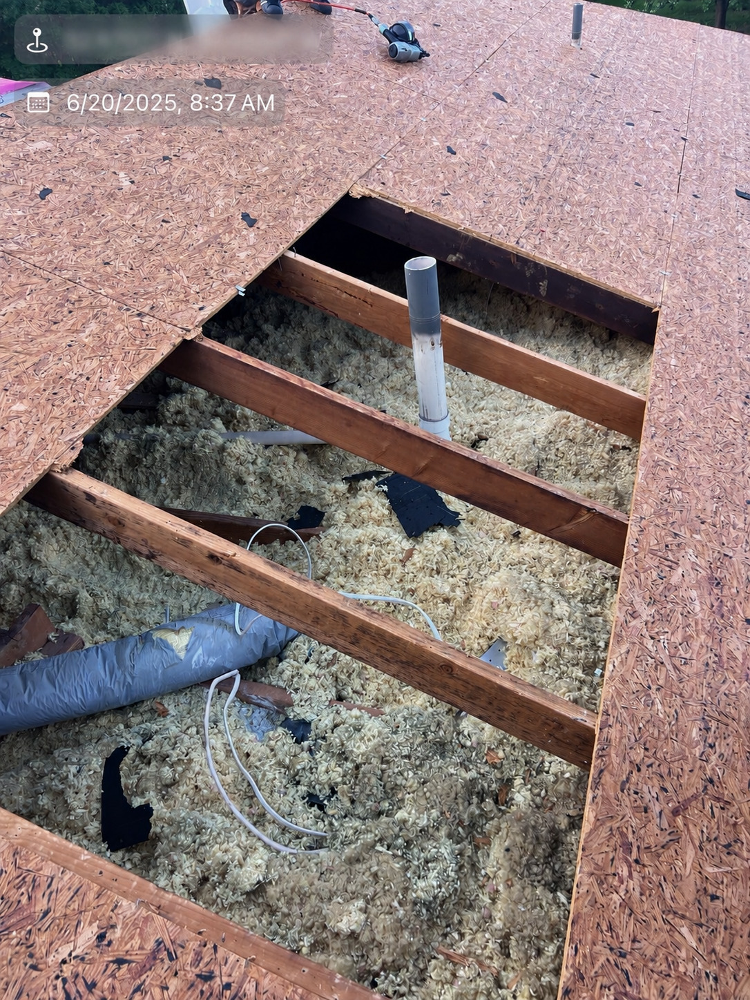 Damaged roof decking being replaced during roof installation
