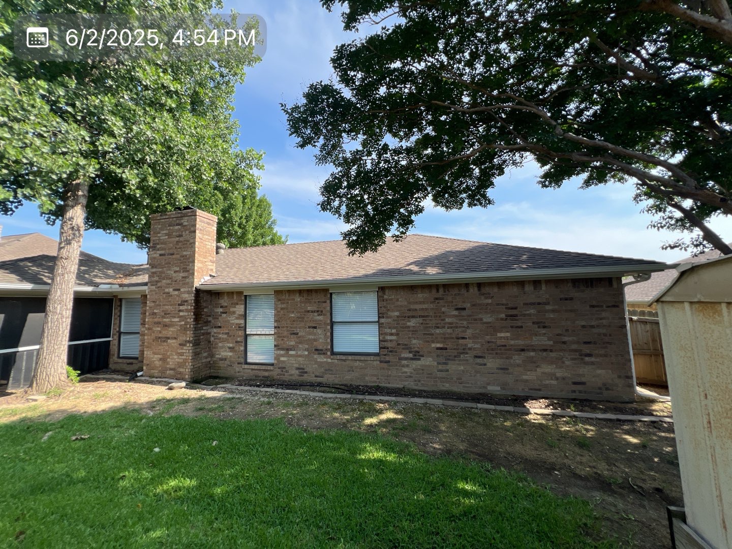 Back of home before roof replacement by MVP Construction & Remodeling